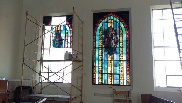 Old stained glass being removed